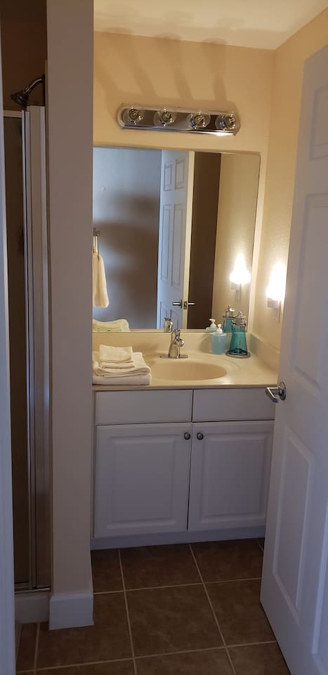 Bathroom next to bunk beds 