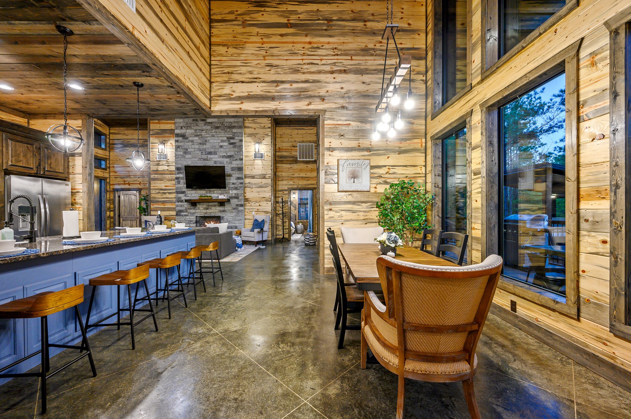 Modern rustic luxury: a sun-drenched space for dining and relaxing.