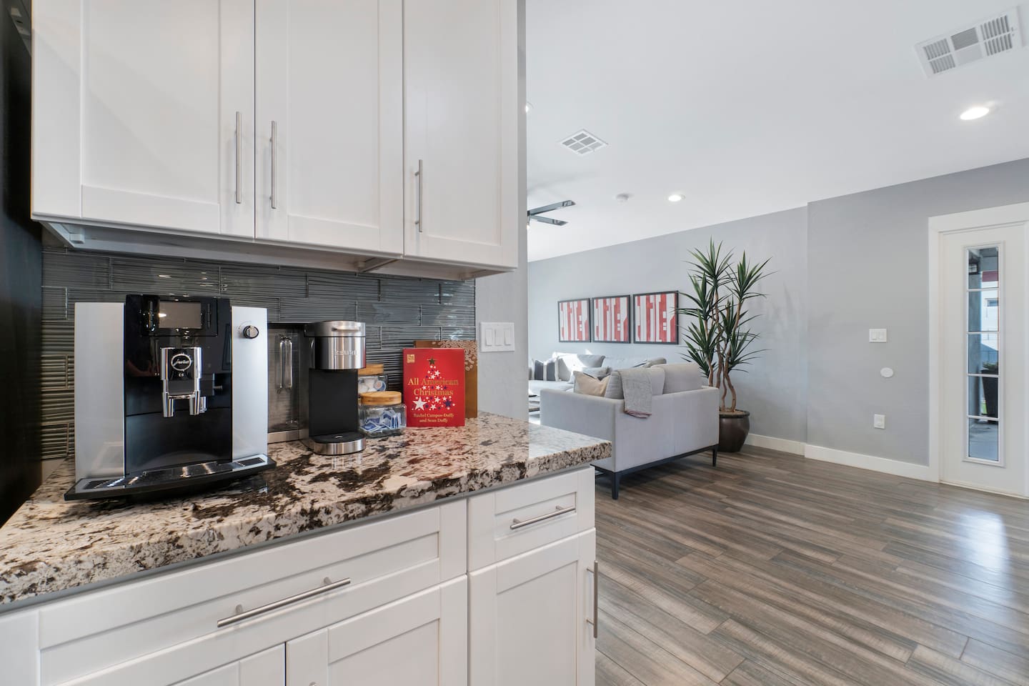 Spacious kitchen with high-end finishes, seamlessly connected to the living area for an open-concept design and perfect entertaining space.
