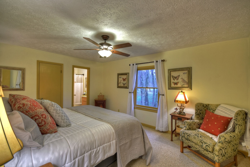 master bedroom w/ private bath and king bed