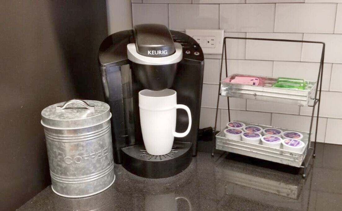 Coffee pods, sugars, non-dairy creamers provided.