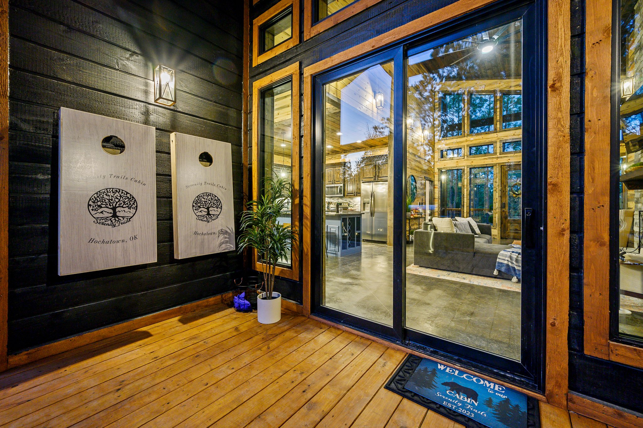 Warm evening glow and custom games on the private covered entrance.