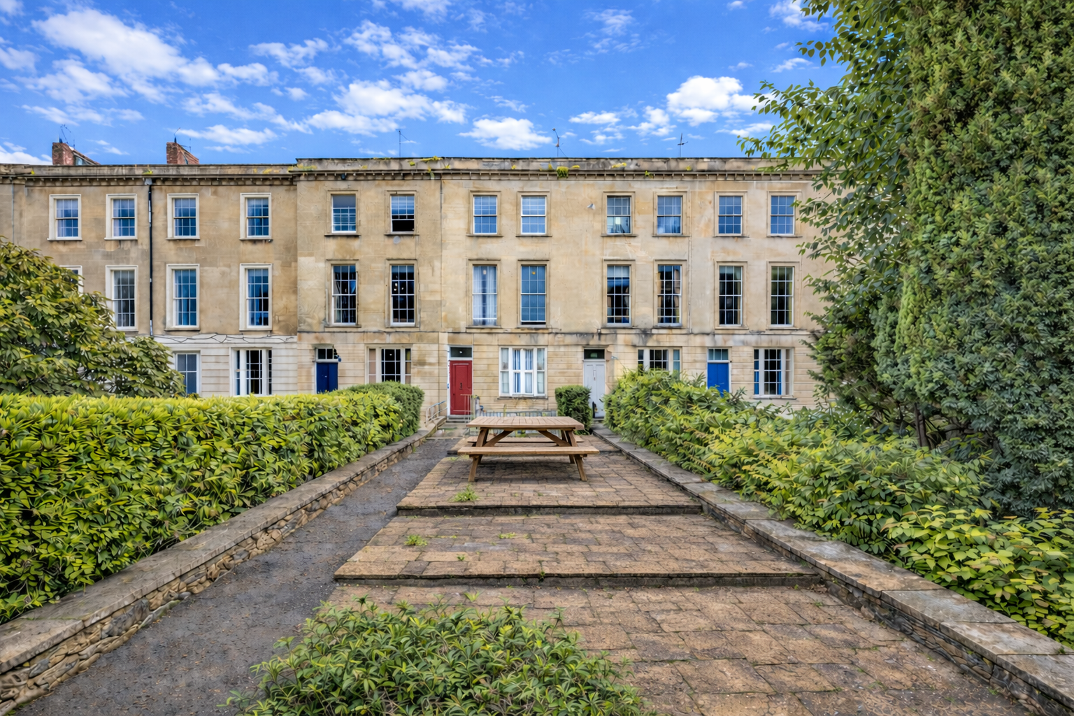 The elegant Georgian façade of our 1841 Clifton townhouse, tucked away in a quiet green setting just steps from the cafés, restaurants, and cinema of Whiteladies Road.