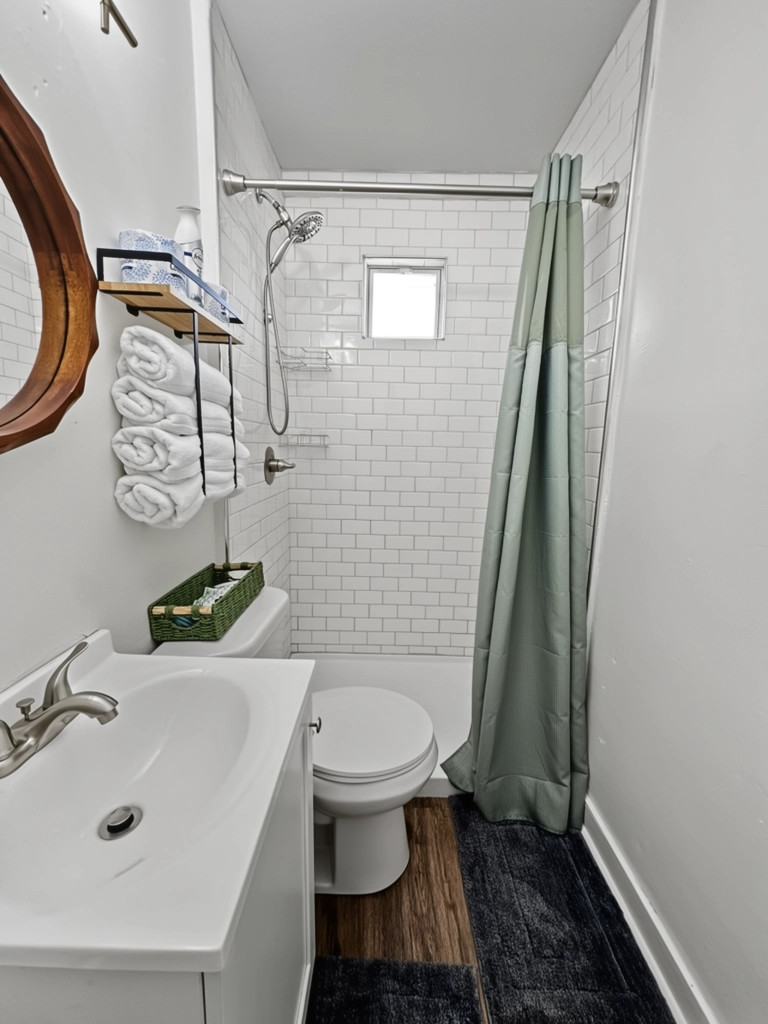 Small bathroom with all the essentials, including a walk-in shower (no tub)