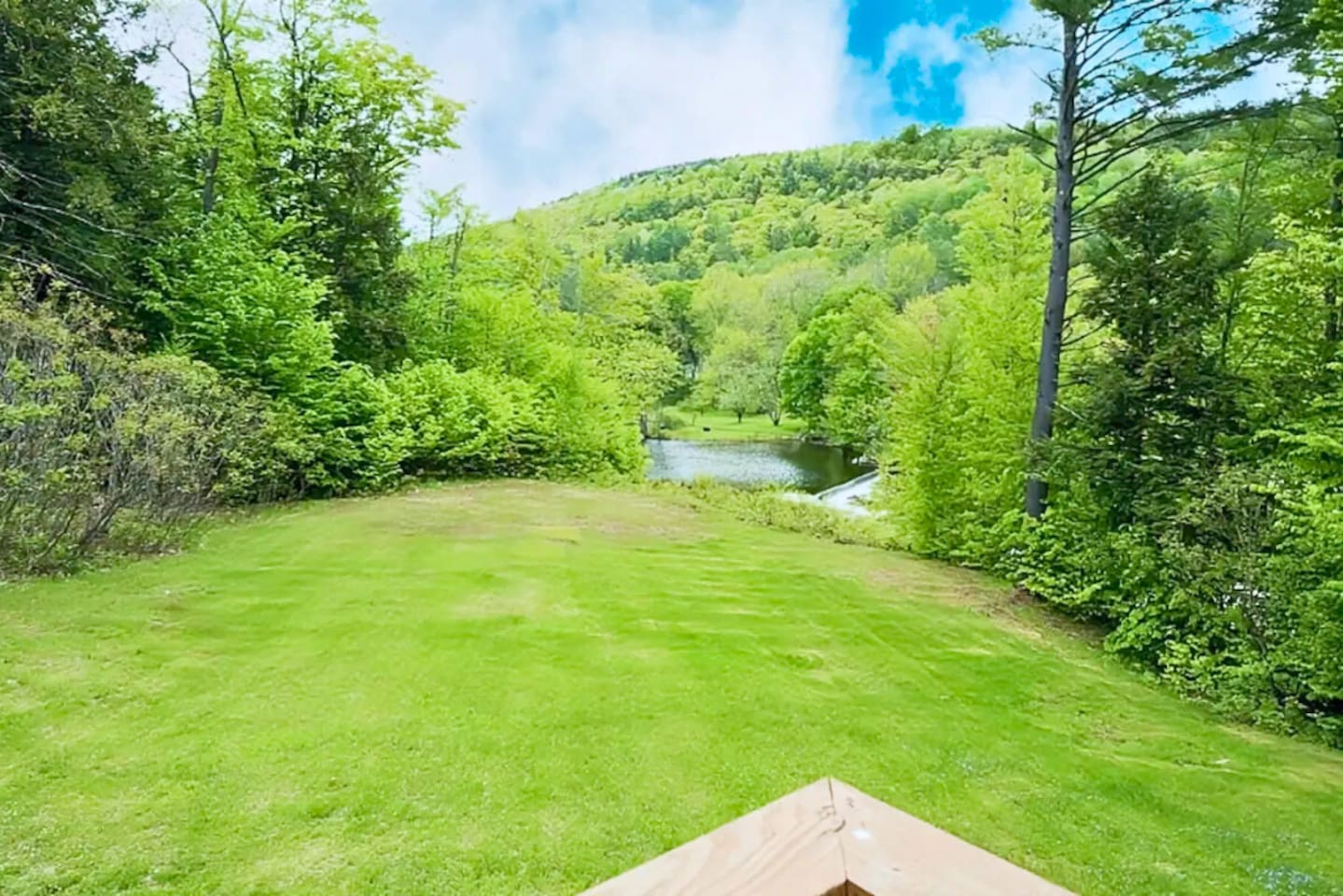 Beautiful lake view / waterfall off the back porch on a nice sunny day!