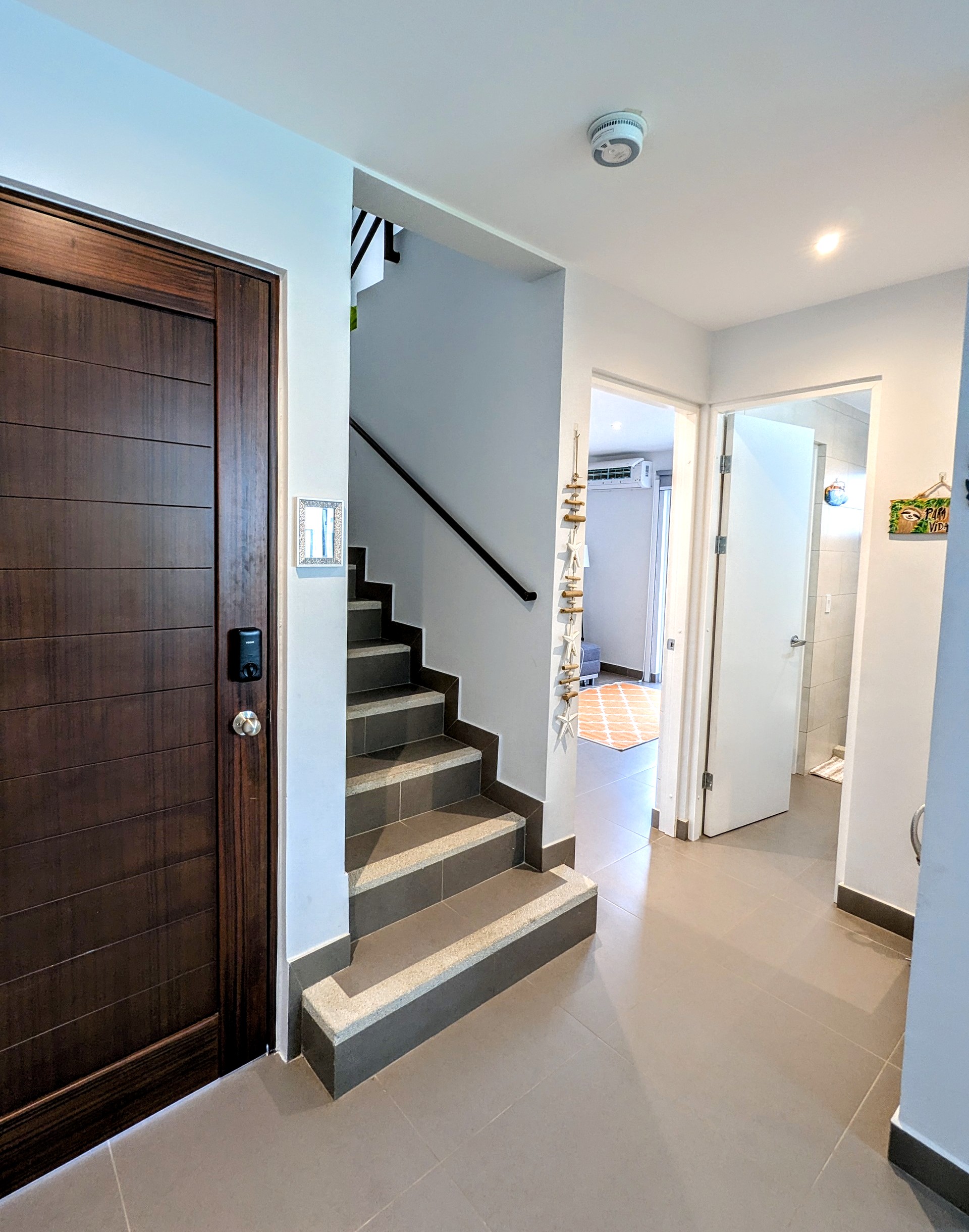 The entrance to the home and stairs leading to the other 3 bedrooms