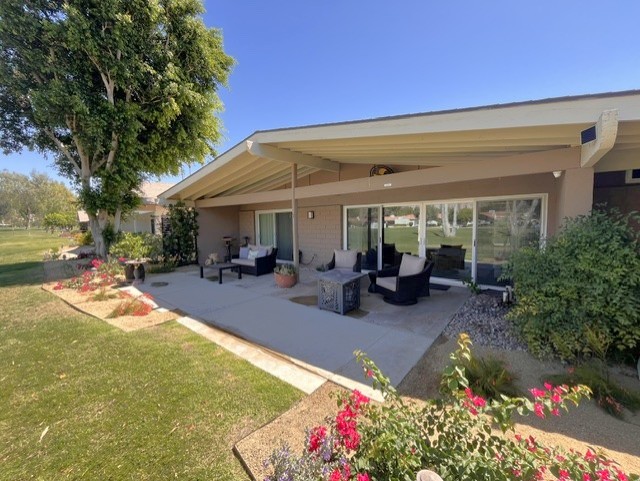Three separate seating areas on extended rear patio.