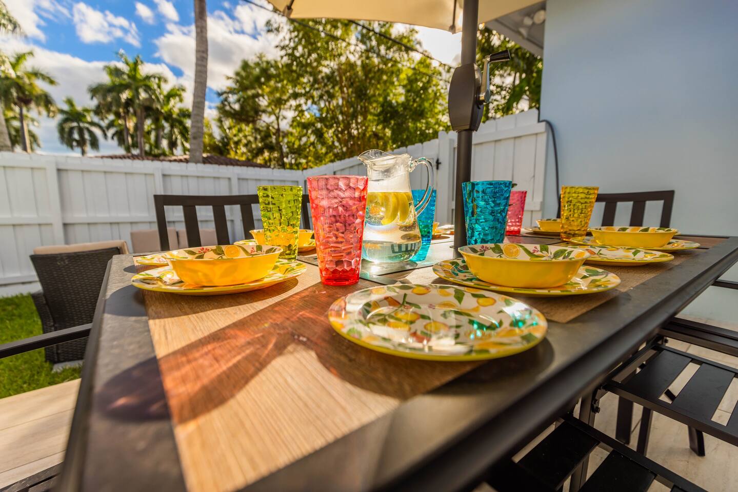 Dine/ BBQ on the patio at the 6 seater dining table and umbrella. Or relax in the new 6 seater hot tub. For those chilly nights, enjoy sitting around the gas powered fire pit lounging areas. The space lit up by remote controlled string lights.