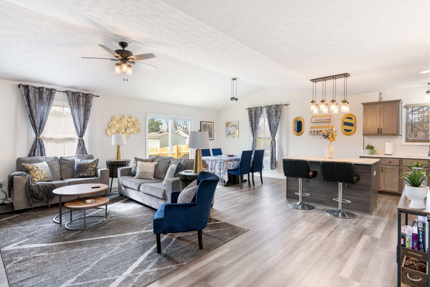 spacious living area with queen sized couch bed, tv, and electric fireplace heater