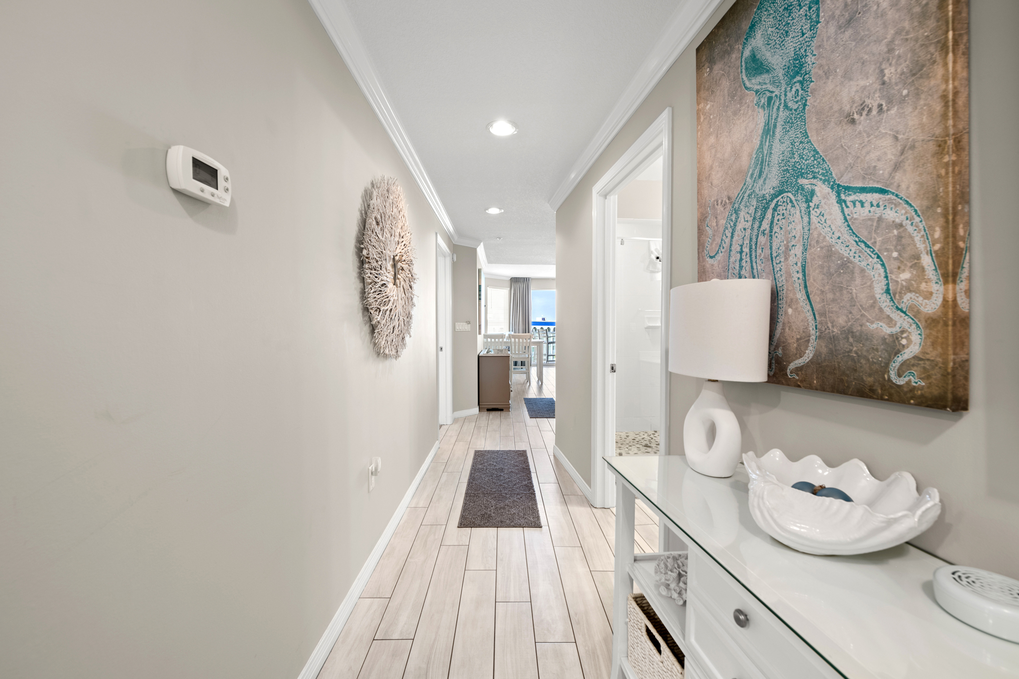 Welcoming entry hallway w/ soft light and coastal touches