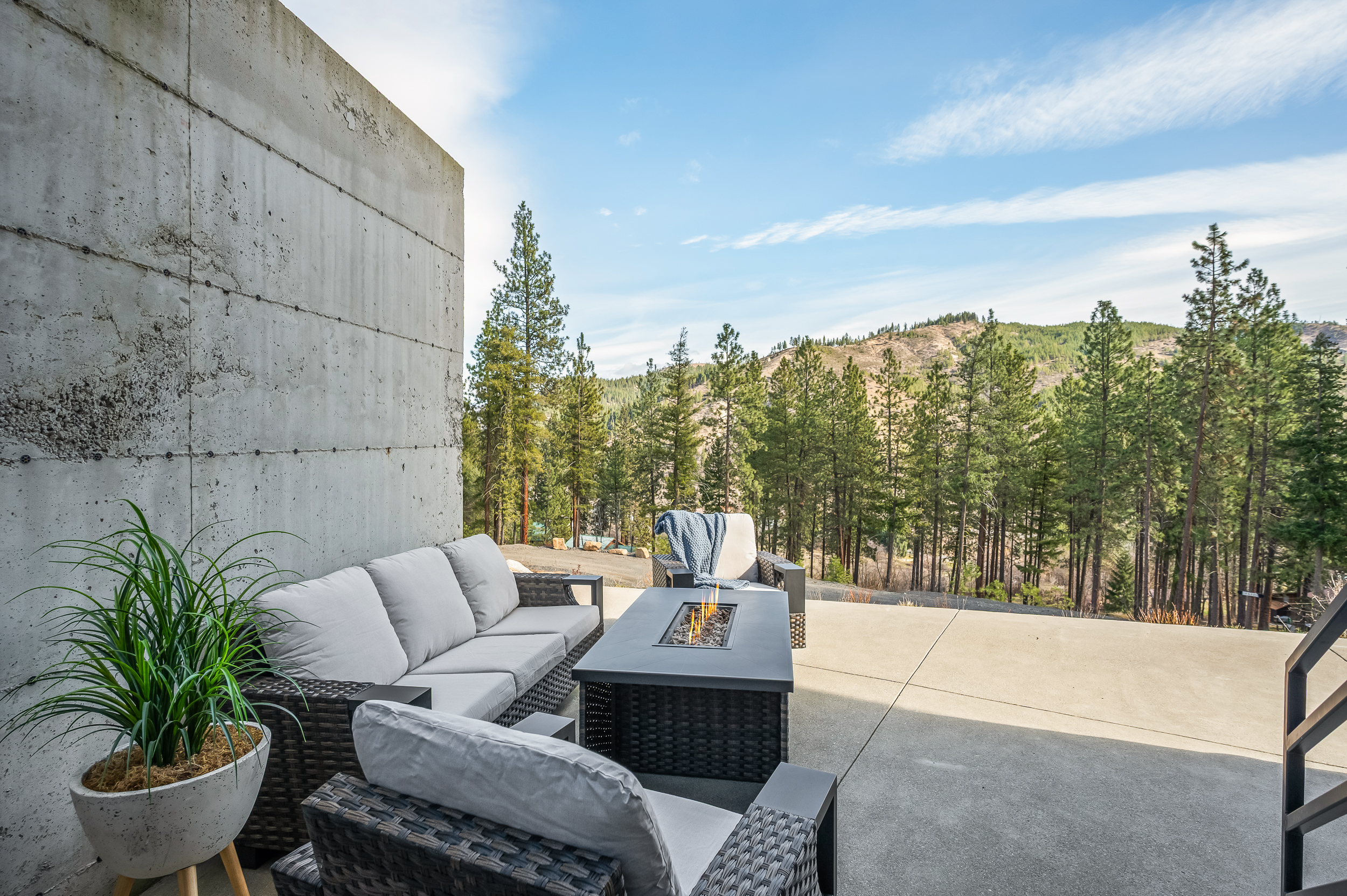 Outdoor lounging with fire table and gas BBQ, both with propane provided