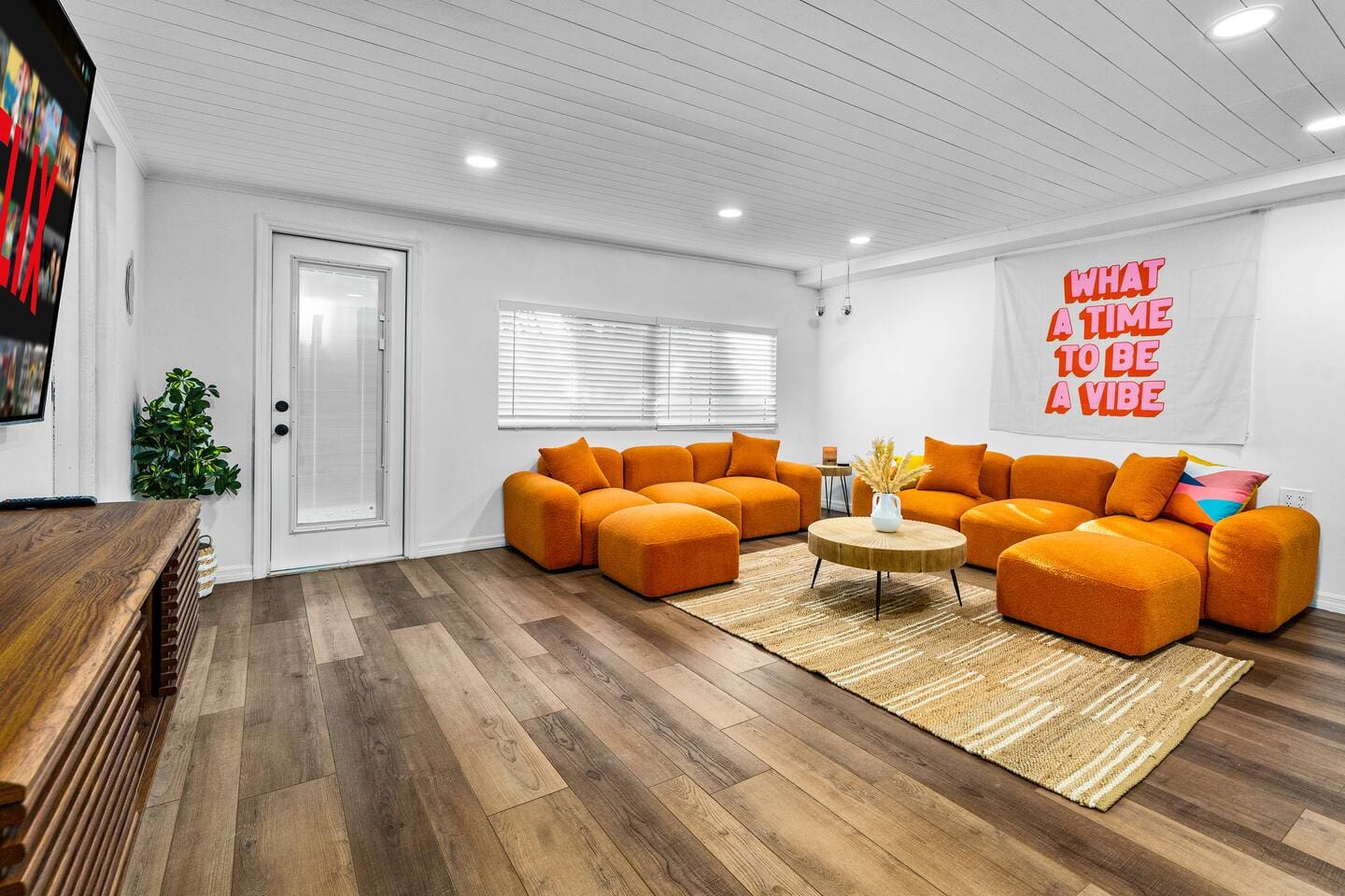 Retro living room with 75-inch LED TV.