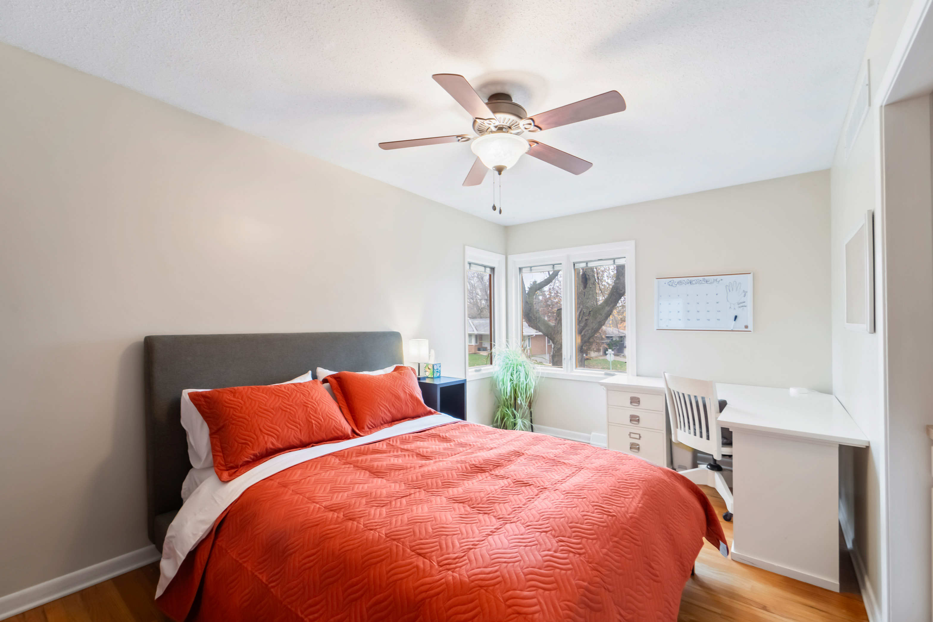 This room has a full corner desk with a comfortable rolling chair plus a whiteboard and corkboard to accommodate for those who can work from anywhere.