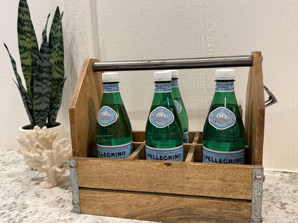 Drink carrier with a bottle opener