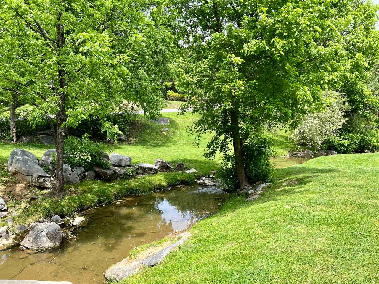 Stream Under Quaint Bridge at Entrance