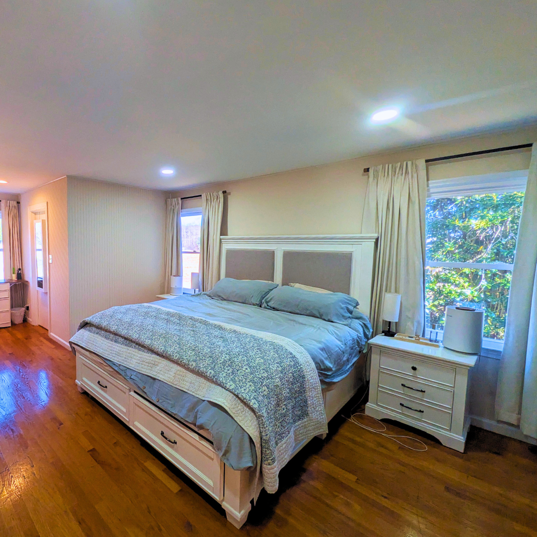 Peaceful bedroom retreat with a comfortable bed and calming space to unwind.