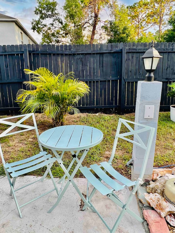 Outdoor seating area with bistro set. This is the designated smoking area as smoking inside the house or the lanai area is not permitted 