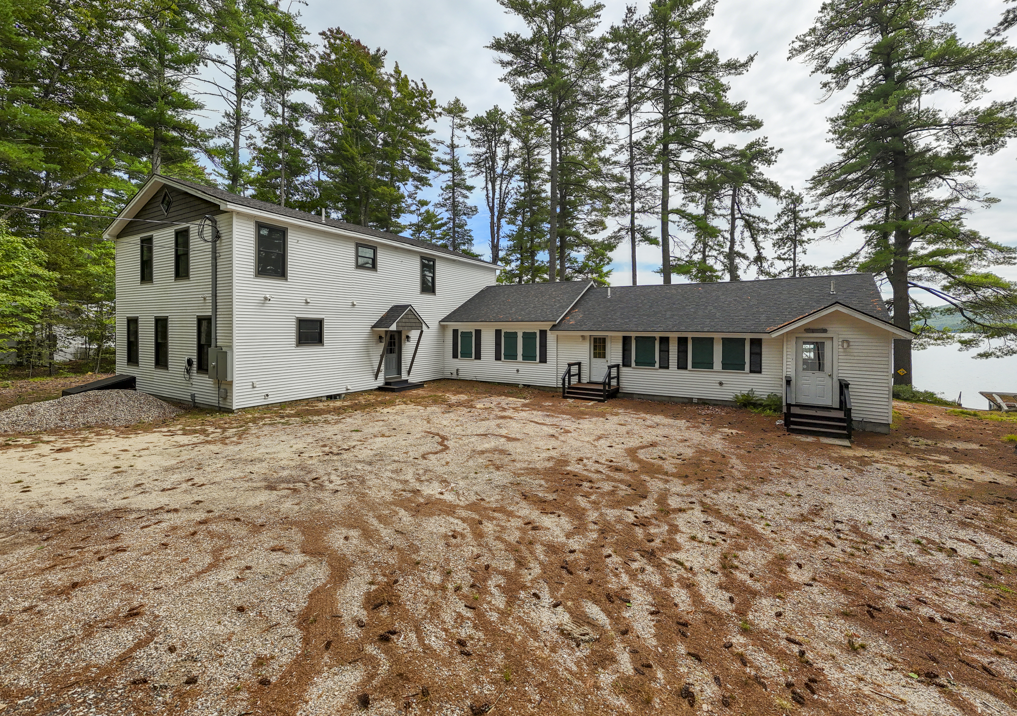 Your rental is the full two-story Great East Lake House (on the left). The attached one-story private residence is not included and has no guest access (on the right).