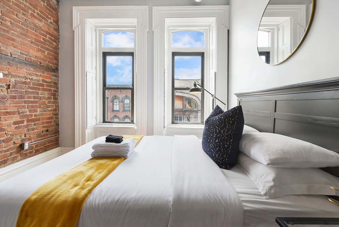 Spacious and elegant queen-sized bedroom with TV designed for comfort and style.