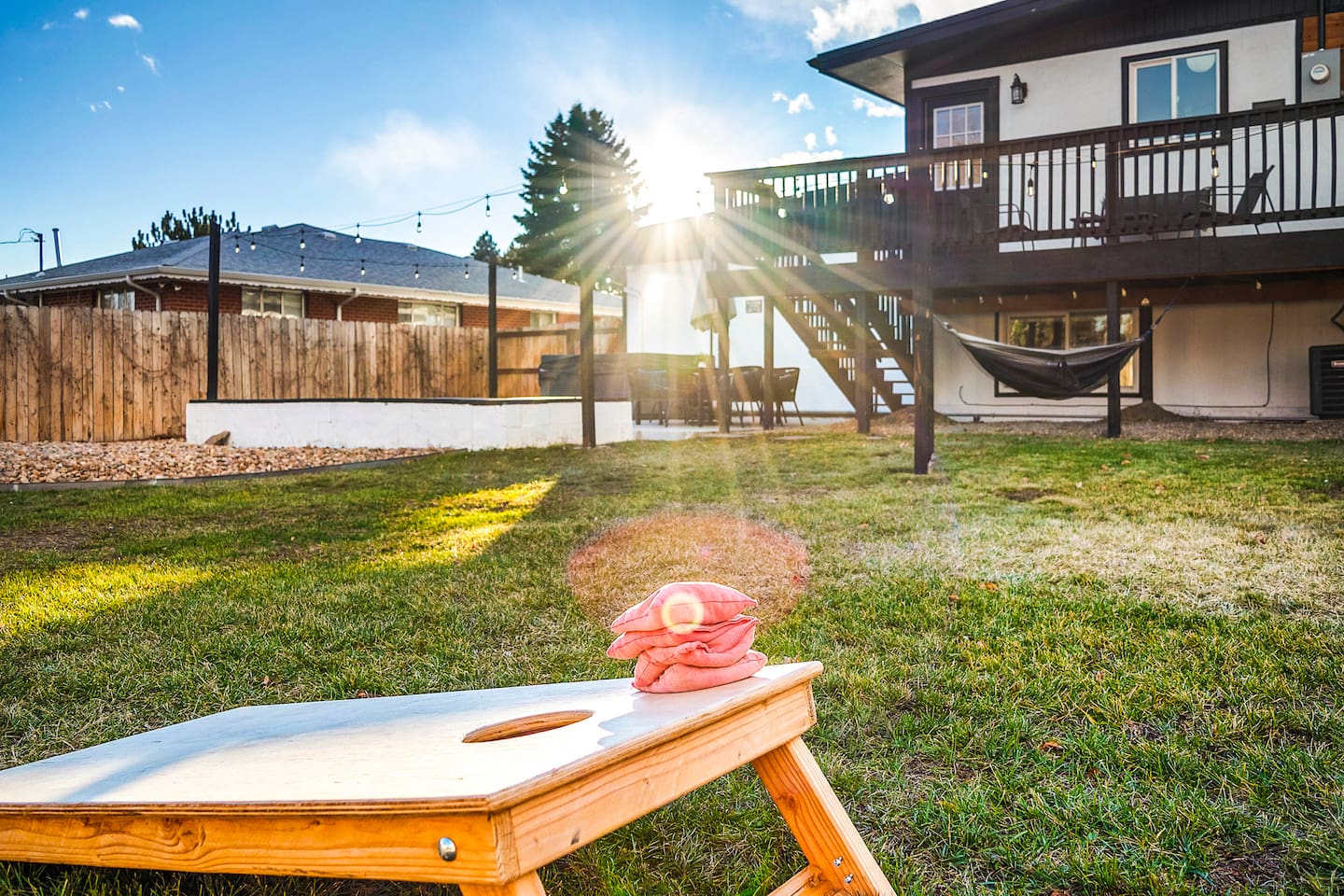 Spacious fenced yard with corn hole fun for family and friends.