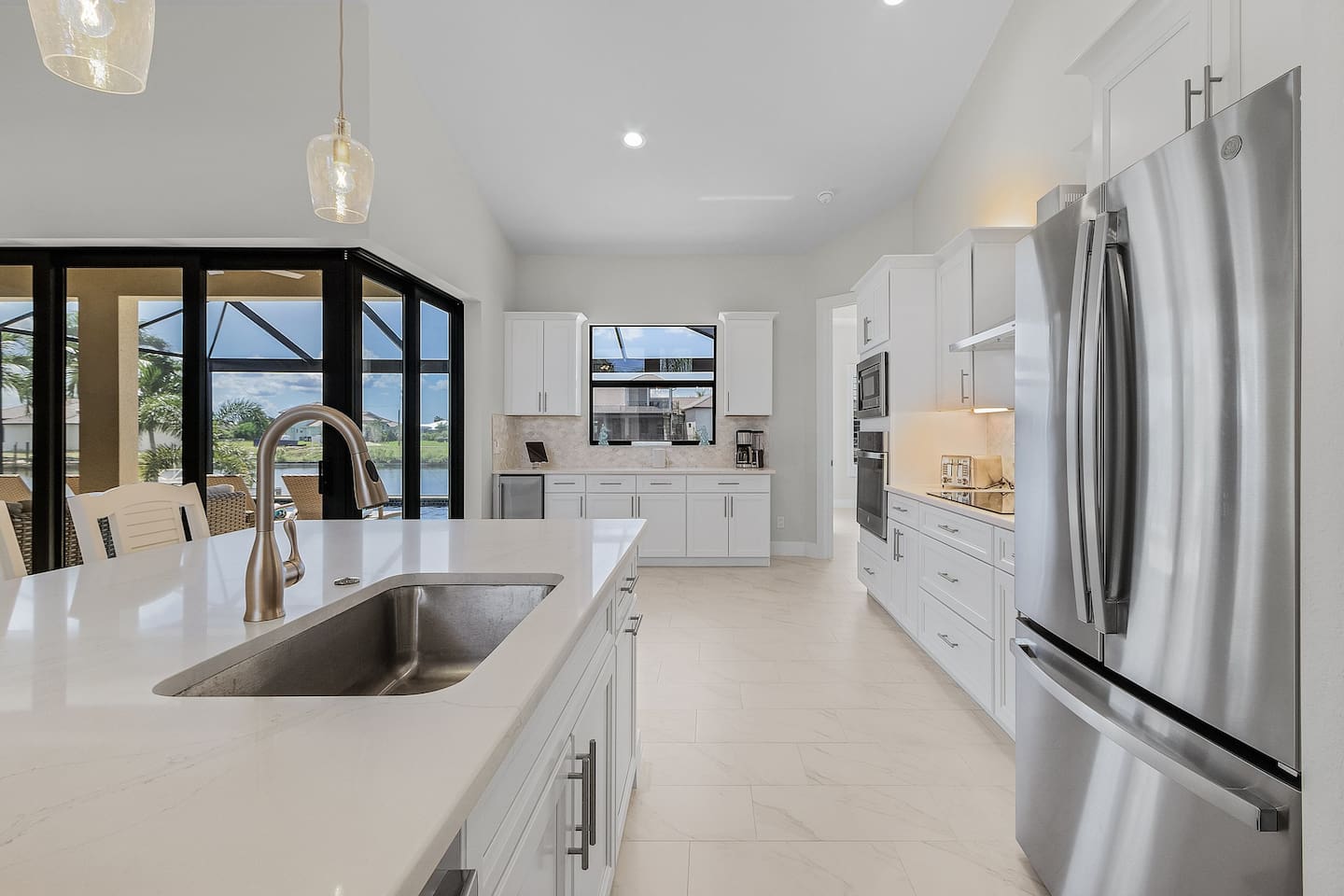 Experience a stunning kitchen adorned with stainless steel appliances, sleek quartz countertops, and ample space for culinary creations!