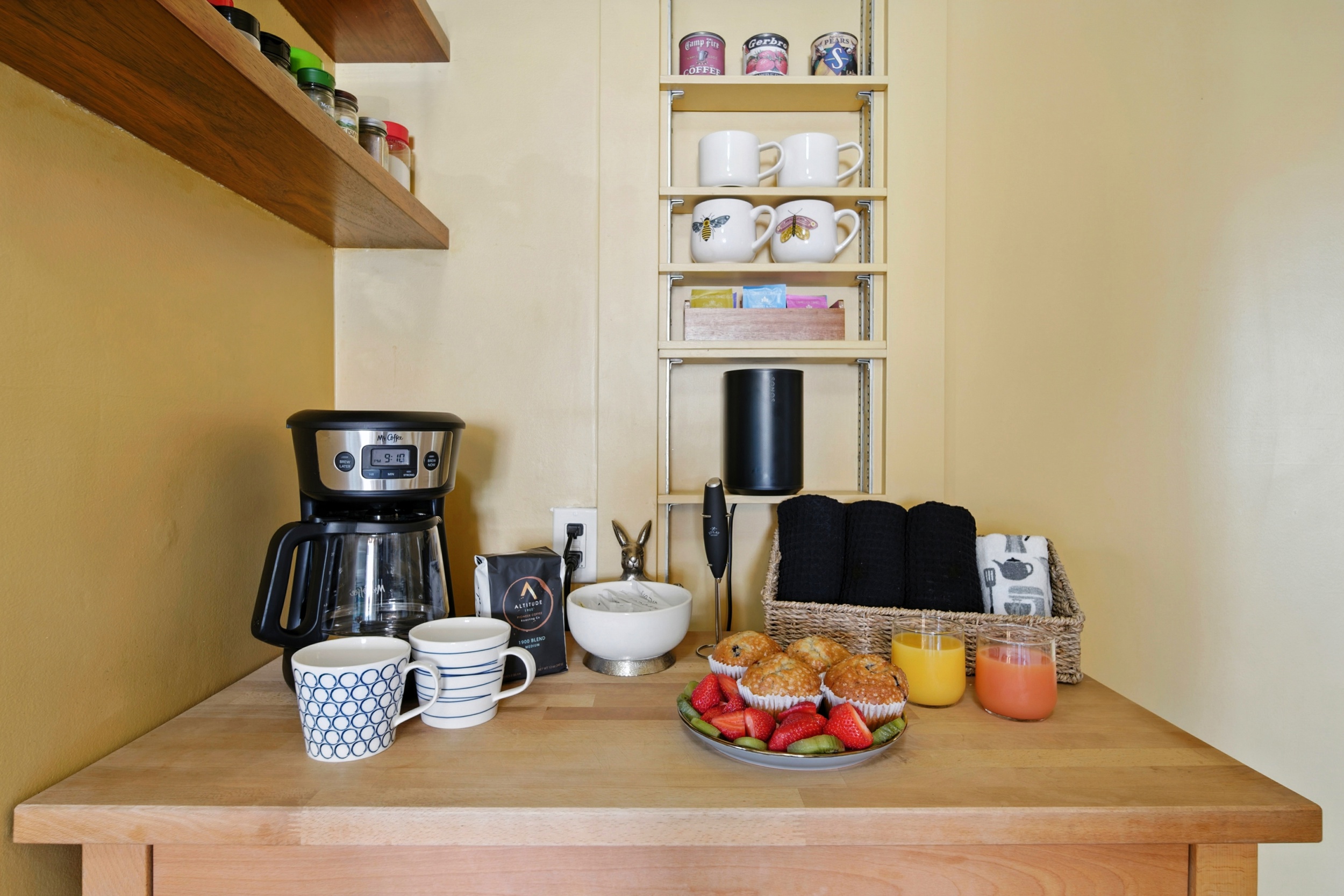 Charming, compact kitchen with a drip coffee maker, frother and ground coffee provided