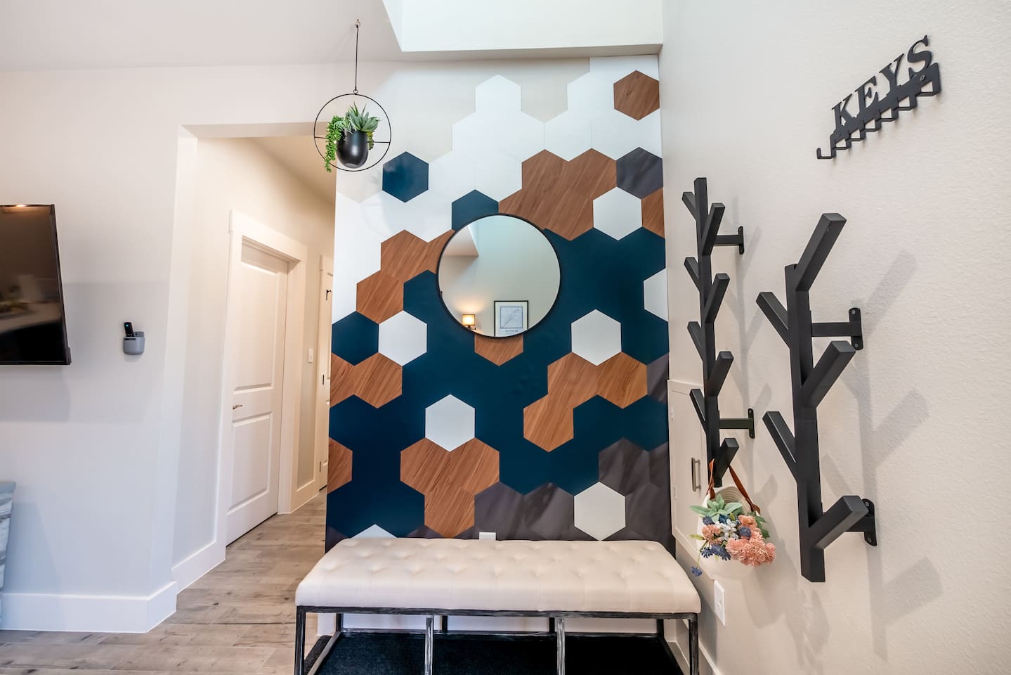 Bench and hooks for easy drop-off, plus a mirror for that final look!