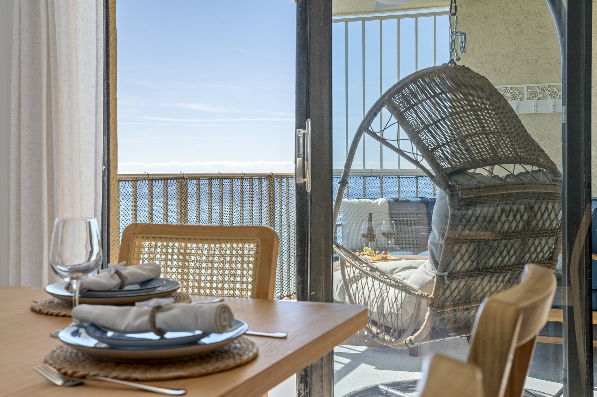 Dine with stunning ocean views, then step out to your breezy balcony swing for the ultimate coastal unwind.