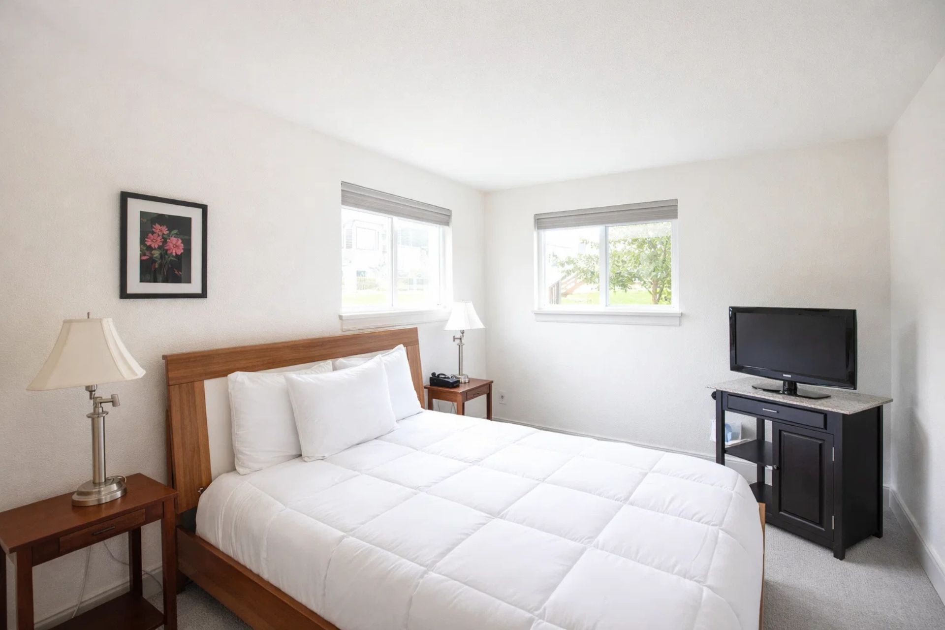 Second Bedroom: Bright and airy retreat with queen bed and flat-screen TV for ultimate relaxation!