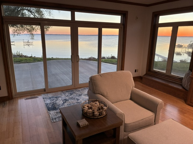 Family room view out to patio and lake sunrise