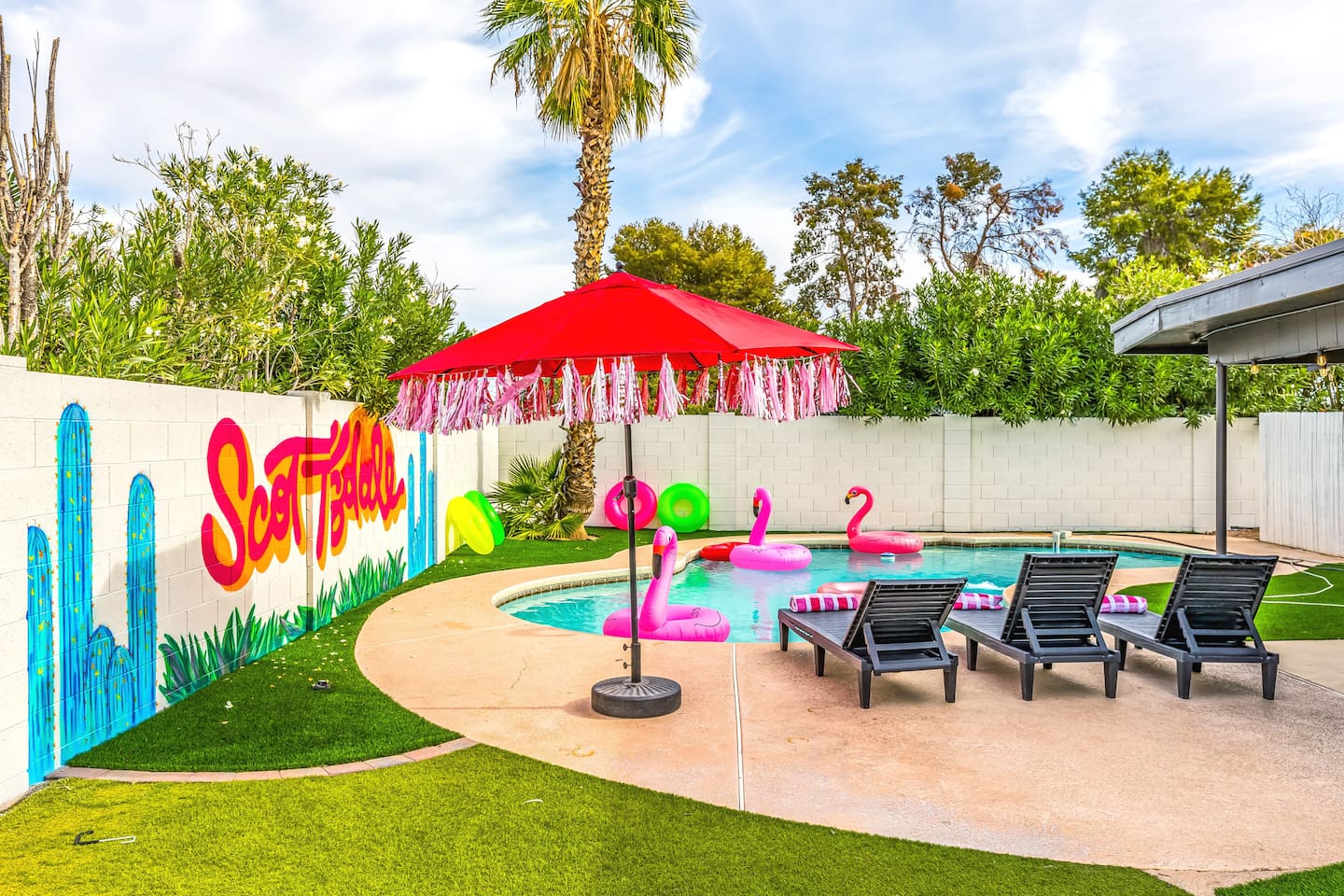 Soak, sip, and repeat under the red fringe umbrella—your private paradise in Scottsdale is calling.

