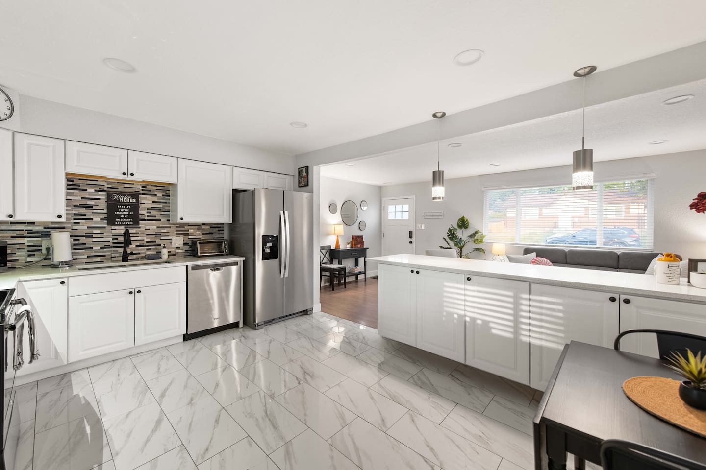 View of front entrance and kitchen from back of unit