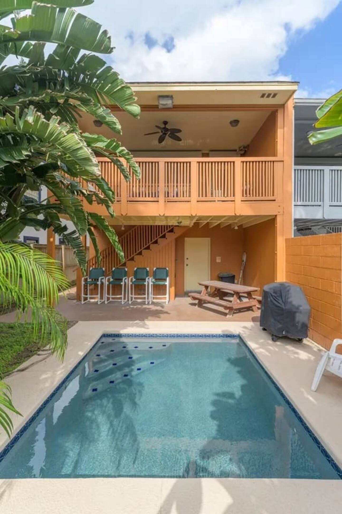 Enjoy a cool dip in the plunge pool in this relaxing backyard oasis.