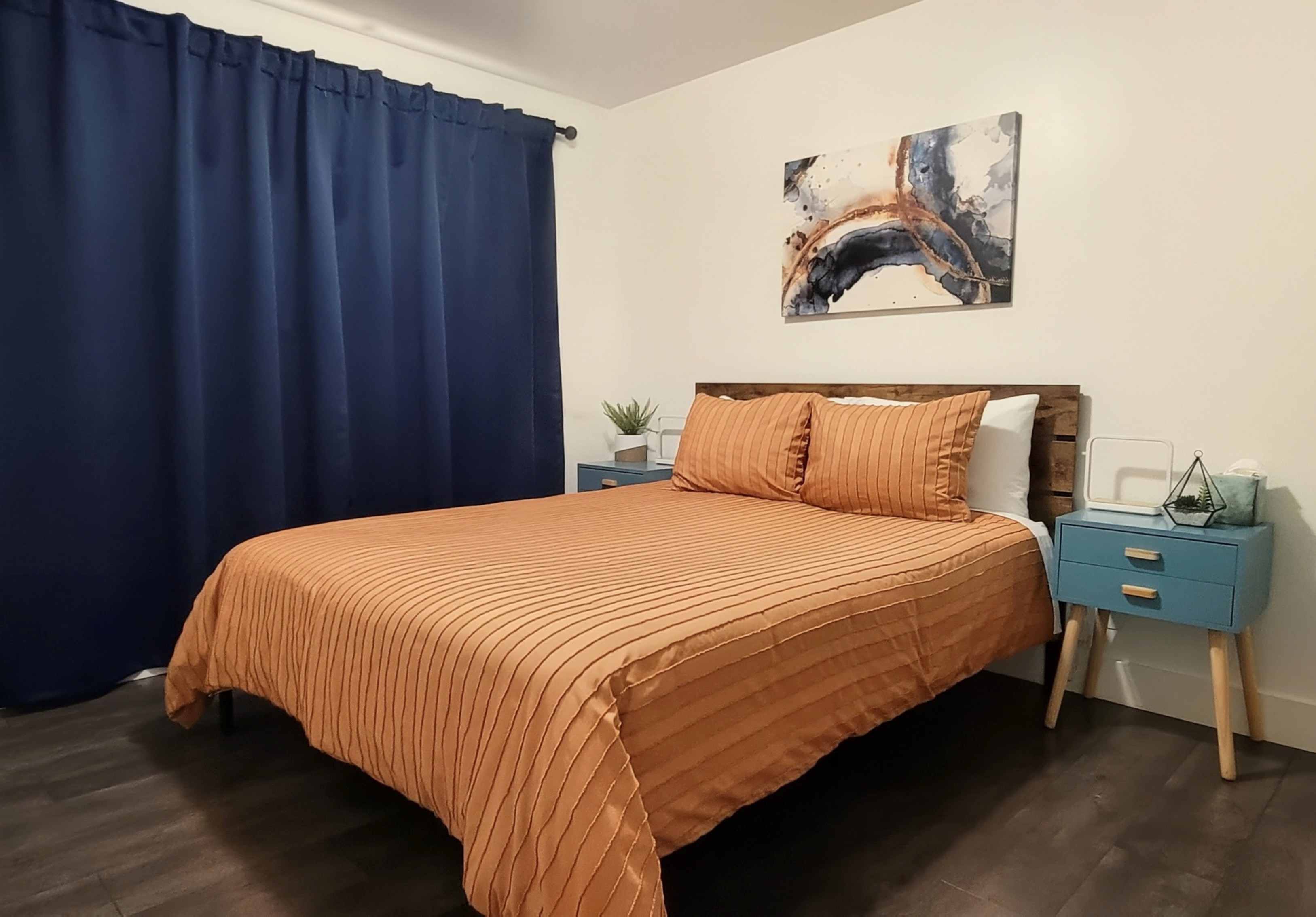 Second bedroom with blackout curtains closed.