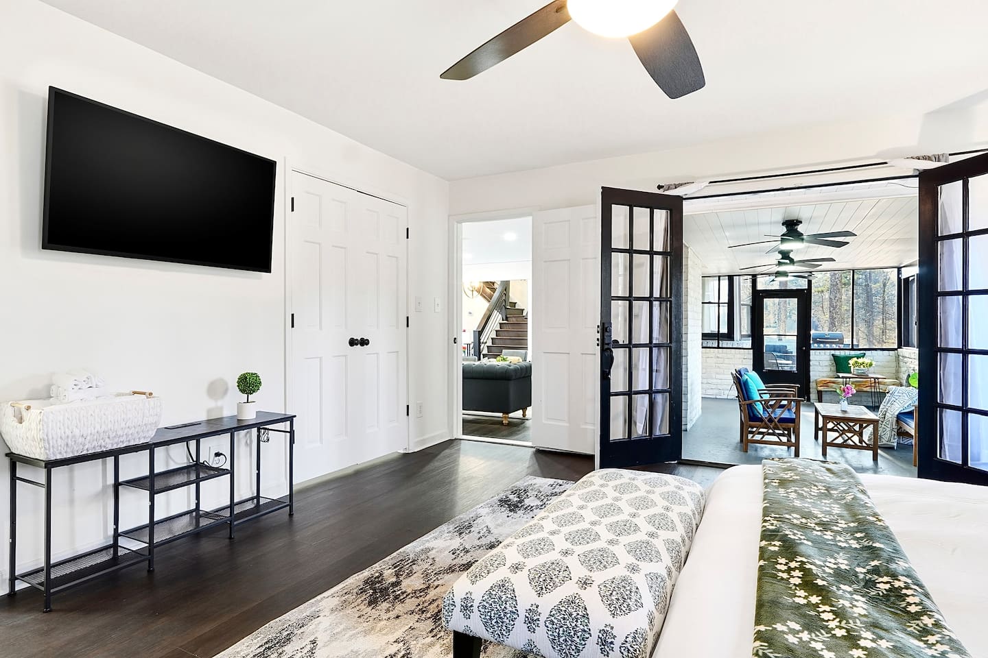 Spacious first-floor master bedroom located to the far right as you enter through the front door. This earthy, calming retreat features a king bed and smart TV. This room includes 2 full-body towels, 2 washcloths, and 2 hand towels for your stay.