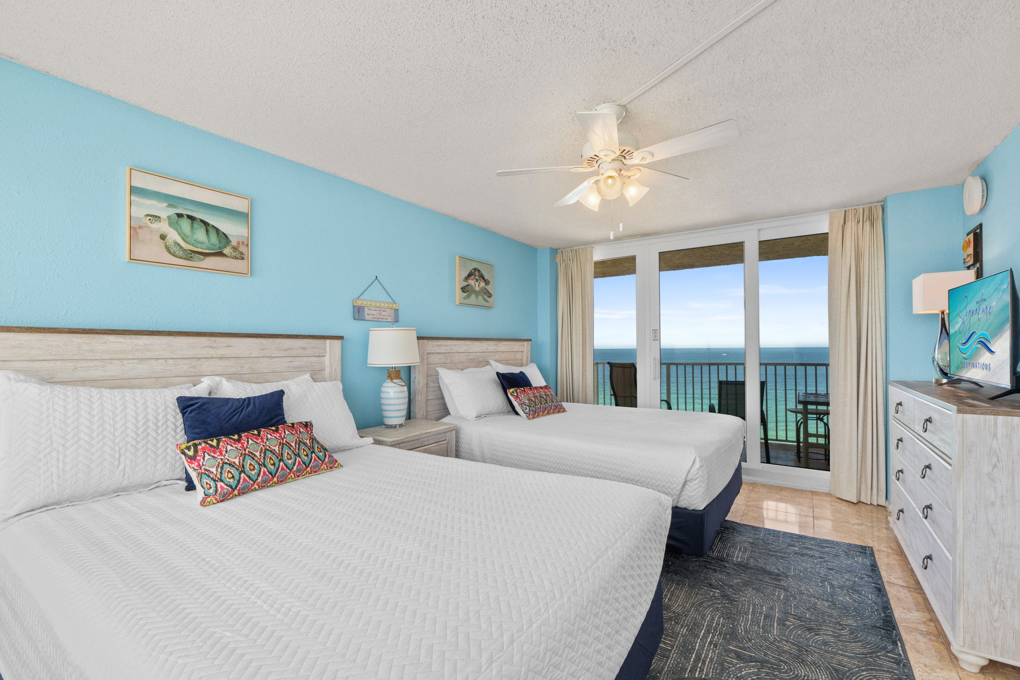 Bedroom 3 with two queen beds and a small private balcony