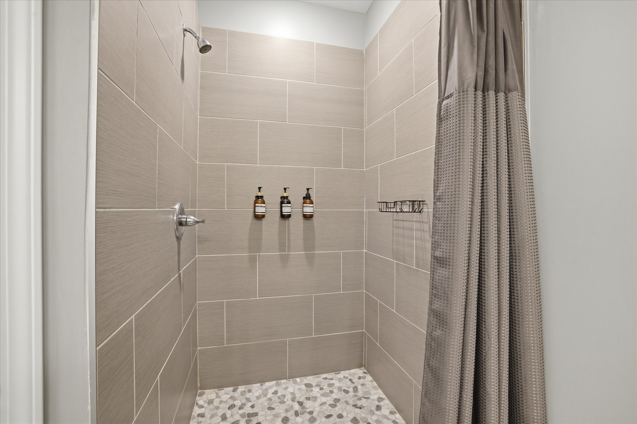 Step into the walk-in stone shower and reset after a long day out. It’s spacious, clean, and simple—just what you want when it’s time to unwind and recharge.