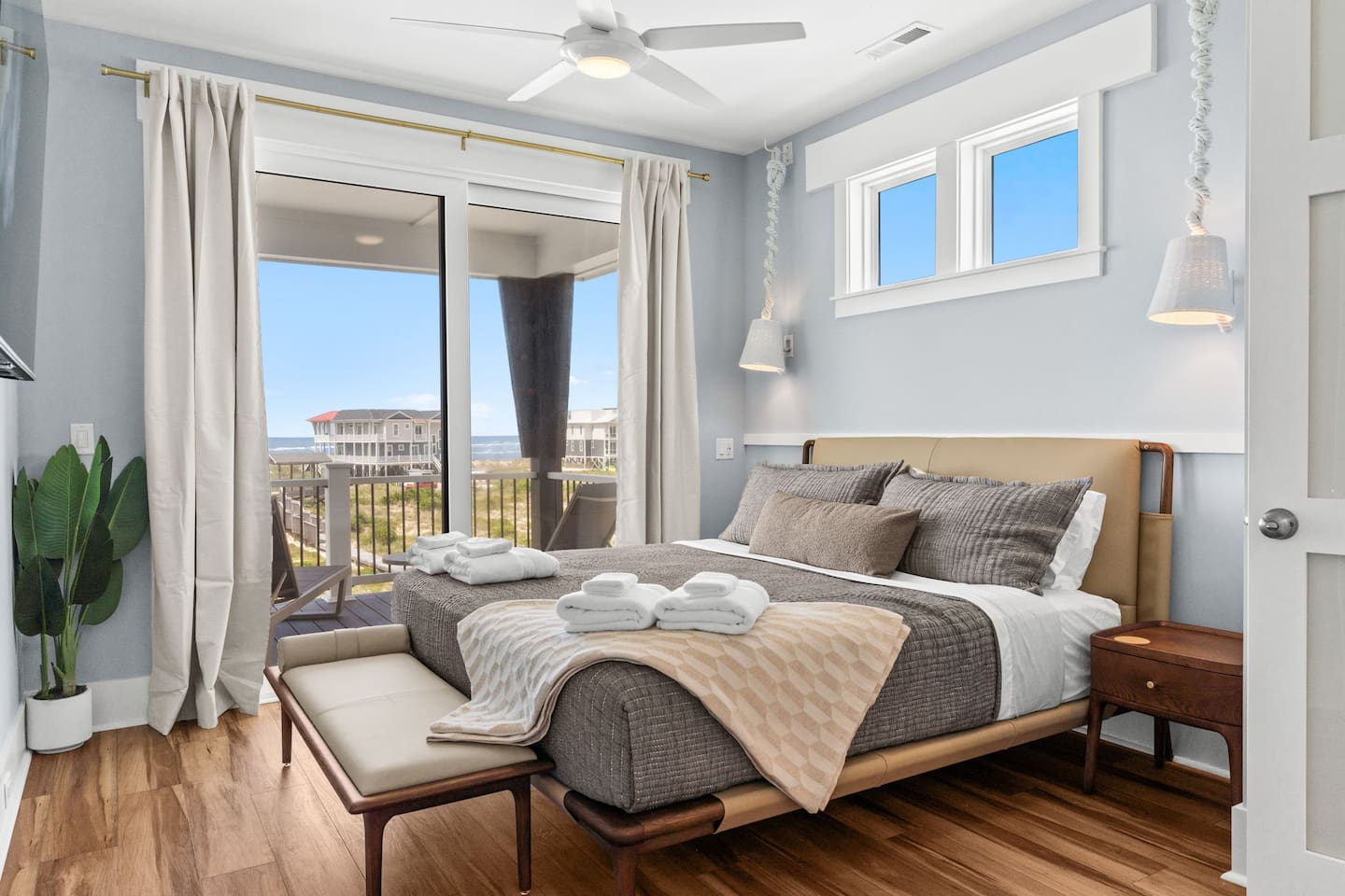 WOW! The upstairs primary suite is a true retreat. Step onto your private balcony and take in sweeping ocean views, creating the perfect space to relax, recharge, and enjoy the beauty of Oak Island.