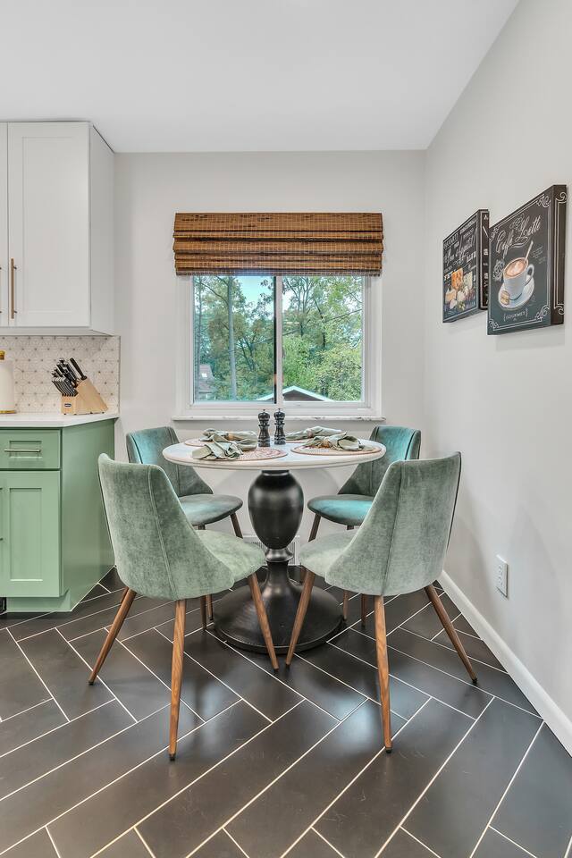 Serve your delicious meals easily at the lovely marble dining table overlooking the backyard.
