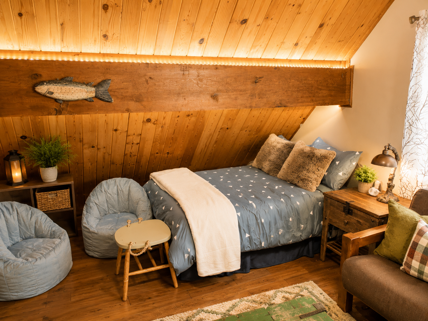The upstairs loft area has 4 beds, a couch that folds into a futon bed and a couple bean bag chairs for the kids.  It also has a tv with cable, a mountain scene that is also chalk board and cozy mountain vibes.
