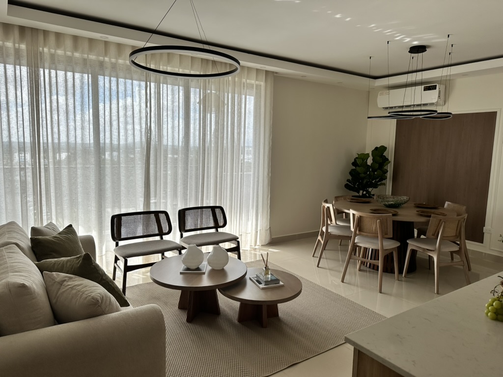 An inviting open-concept space where the living room, dining area, and kitchen come together beautifully. 🤍✨