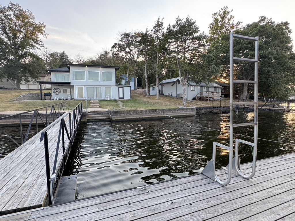 View from dock shows step entry into the lake, and one of two swim ladders