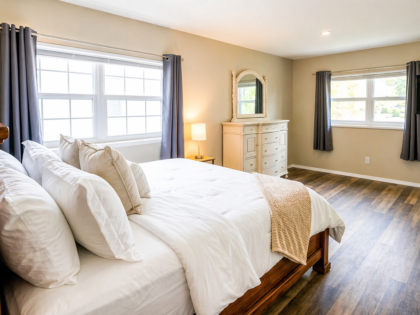 Bedroom 1 - Bright and airy master bedroom with multiple windows and attached ensuite