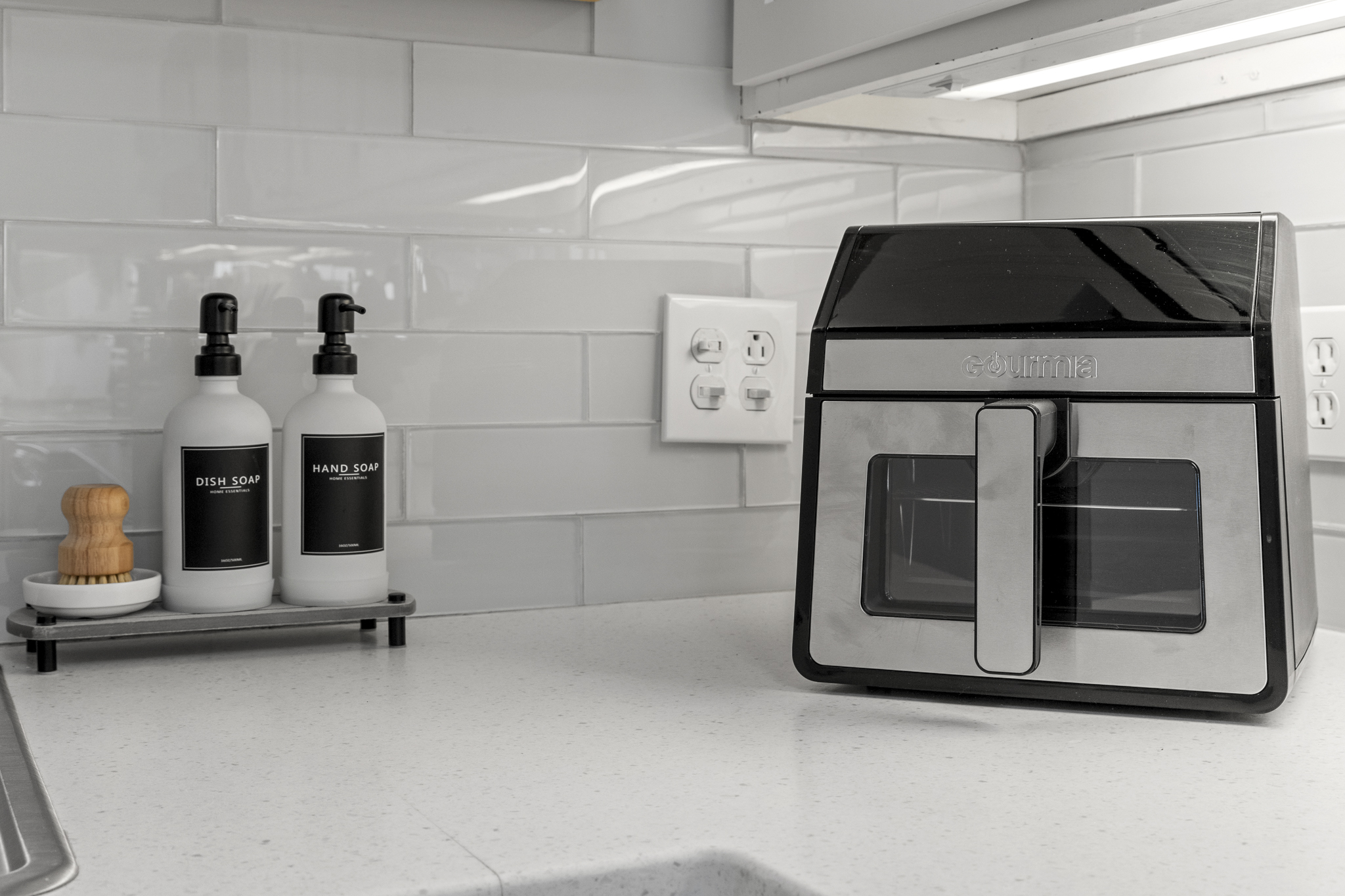 Guest-ready with sleek countertop essentials, offering both function and style for your daily routines.