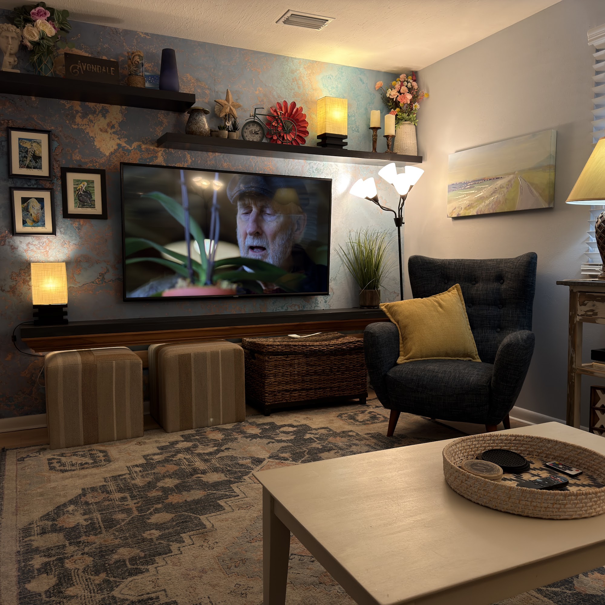 Cozy living room with 65" TV and accent chair