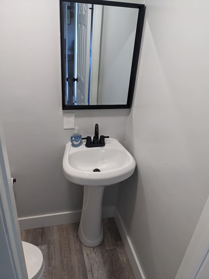 Powder room downstairs to the right of the front door