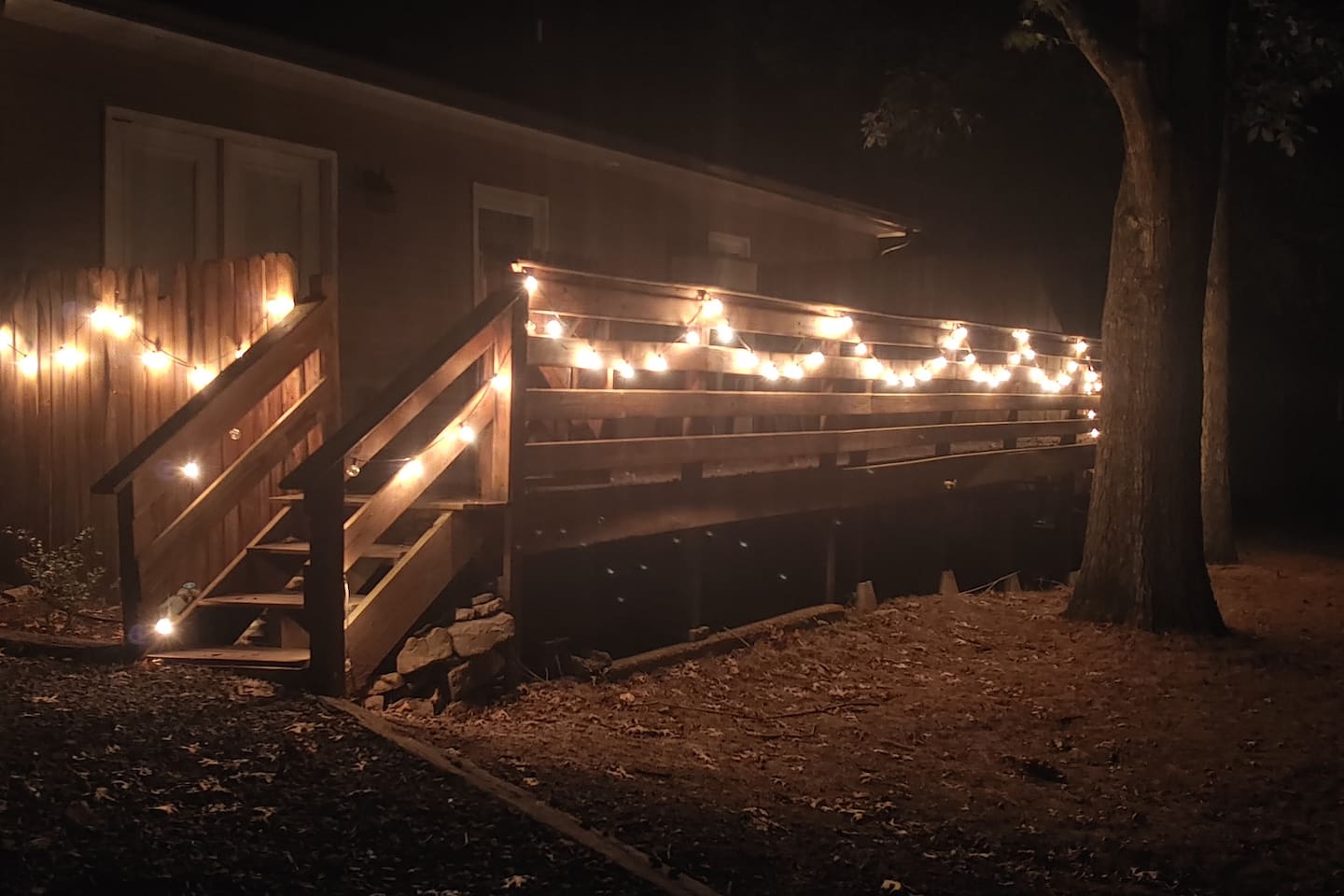 Relax on the large private back deck under the trees.  