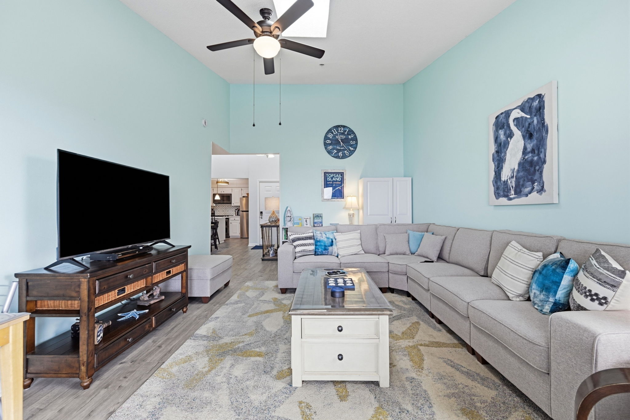 A beautifully open living space where natural light and coastal views take center stage