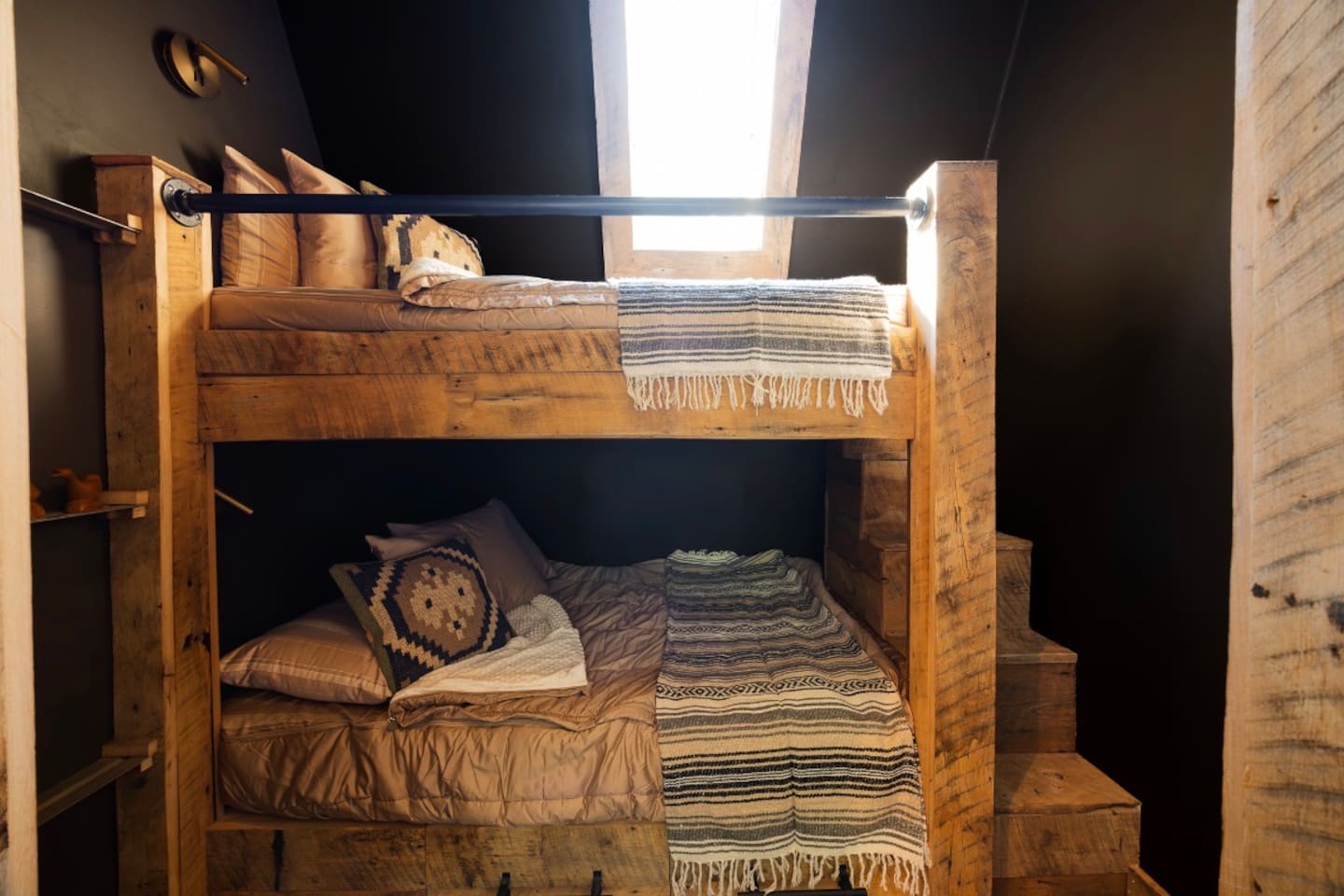 Open loft-style bedroom with private twin-over-queen sleeping area. 