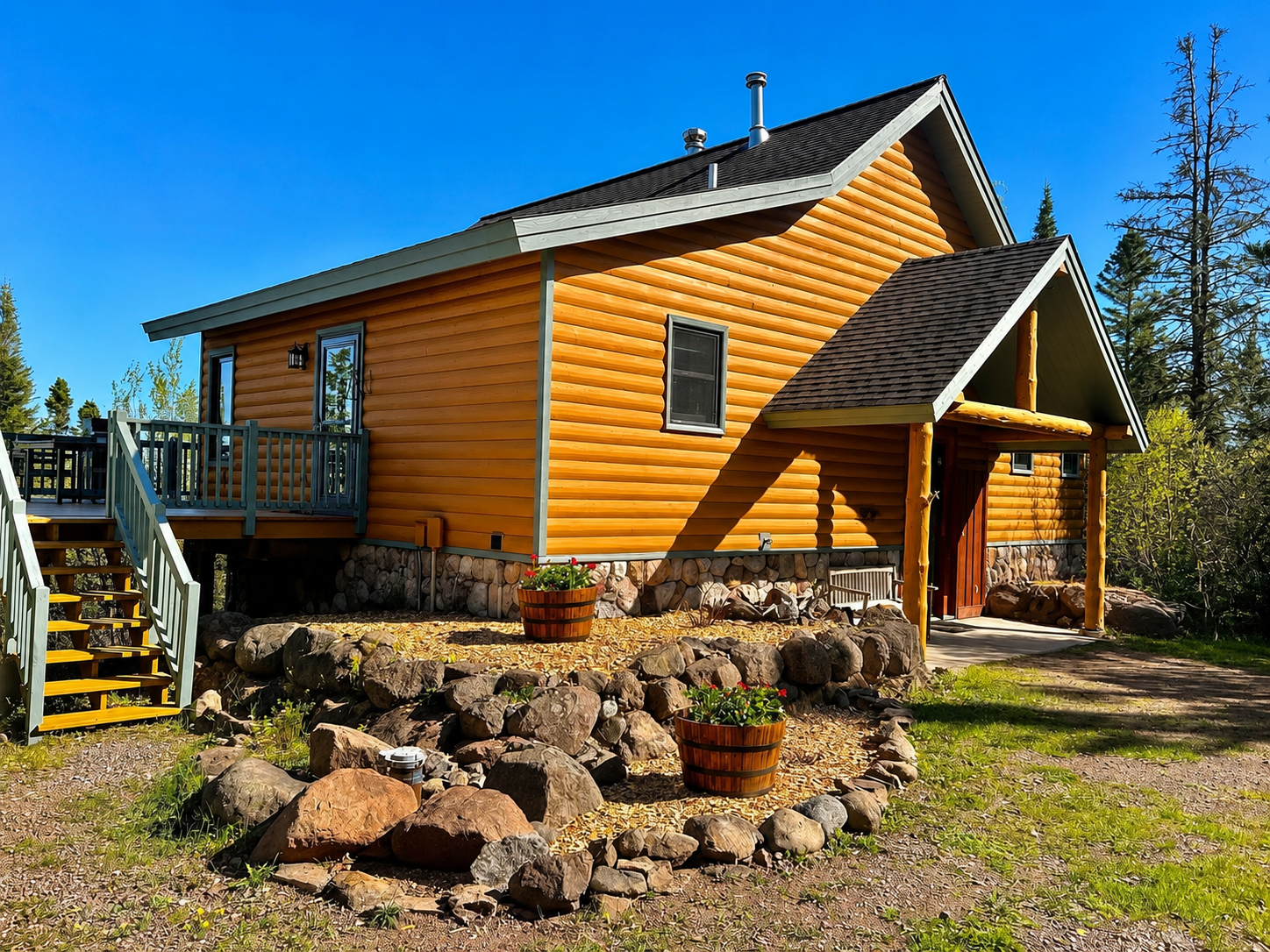 Freshly landscaped exterior of Treetops in Tofte 6/4/2026. An inviting North Shore cabin surrounded by trees, with a refreshed outdoor space perfect for relaxing after hiking, exploring Lake Superior, or visiting nearby Lutsen Mountains.